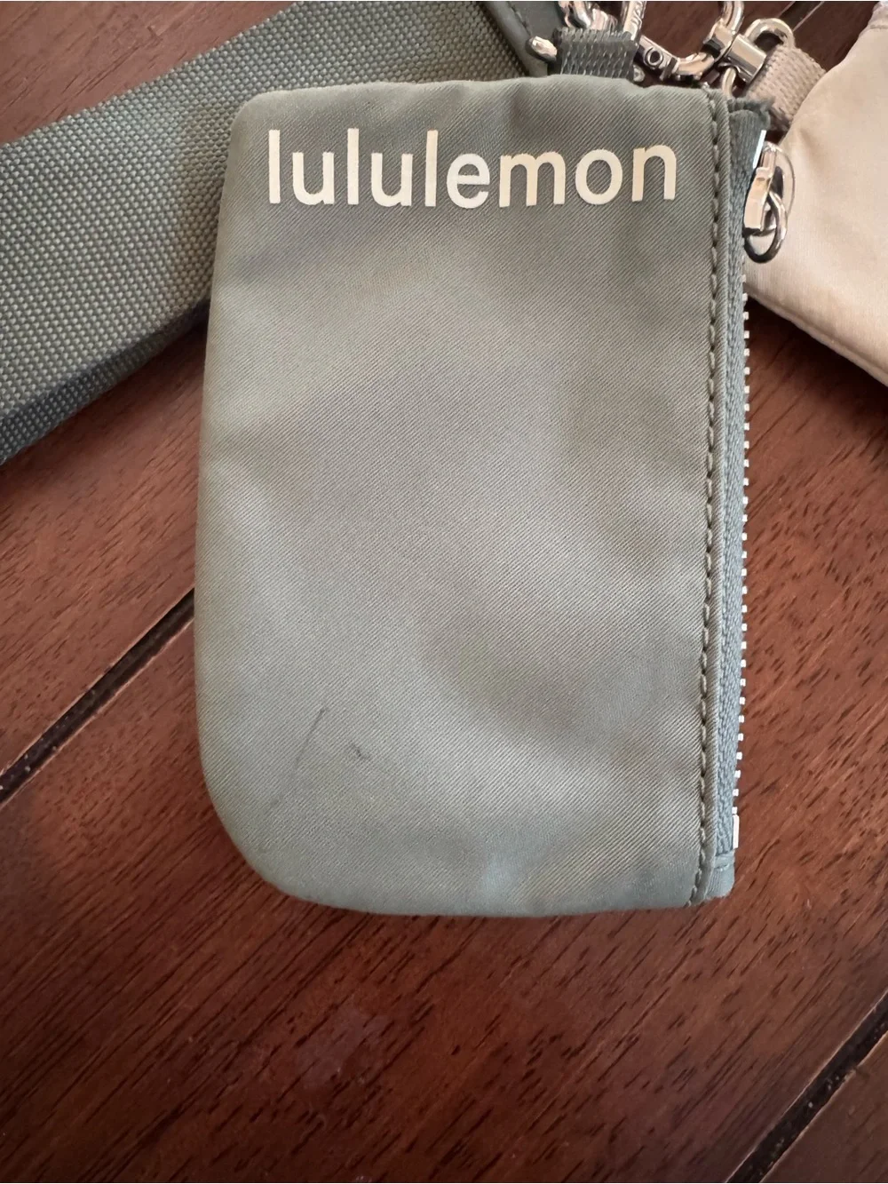 lululemon athletica sage green wristlet with cream coin pouch
